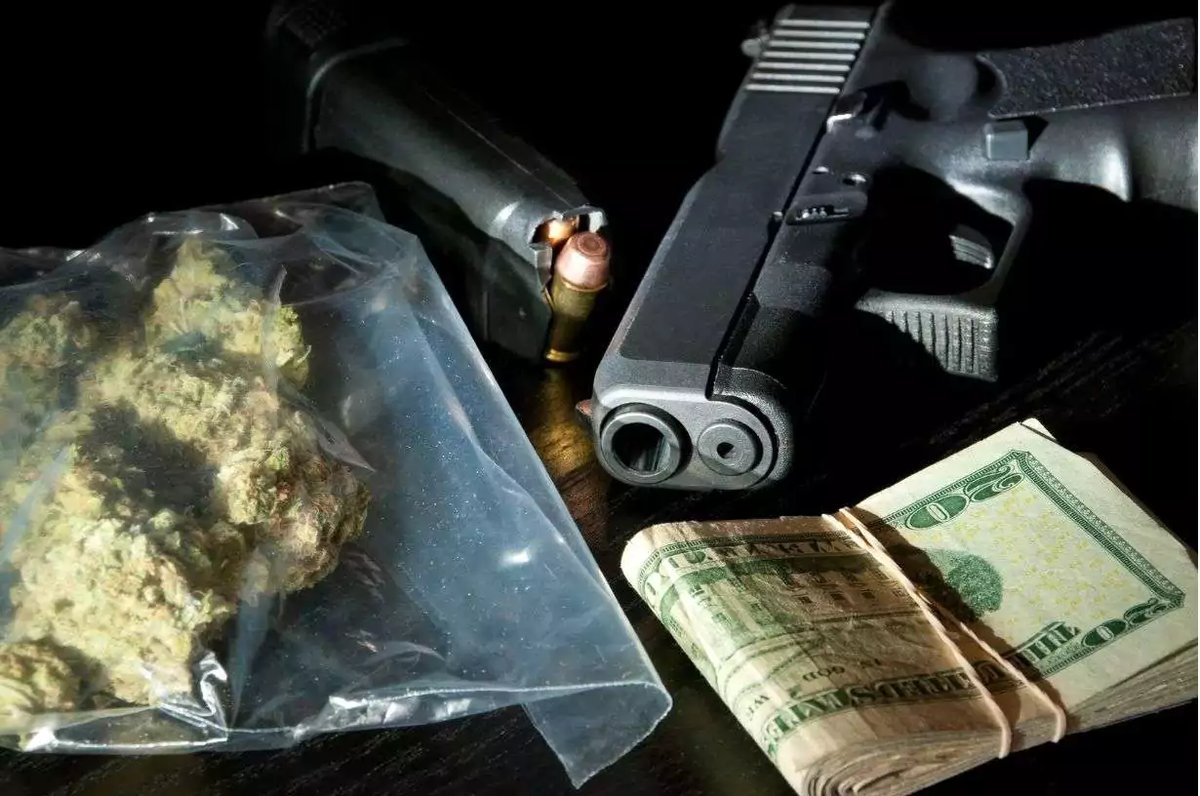 Two men pleaded guilty to unlawful possession of a firearm, ammunition, and cannabis